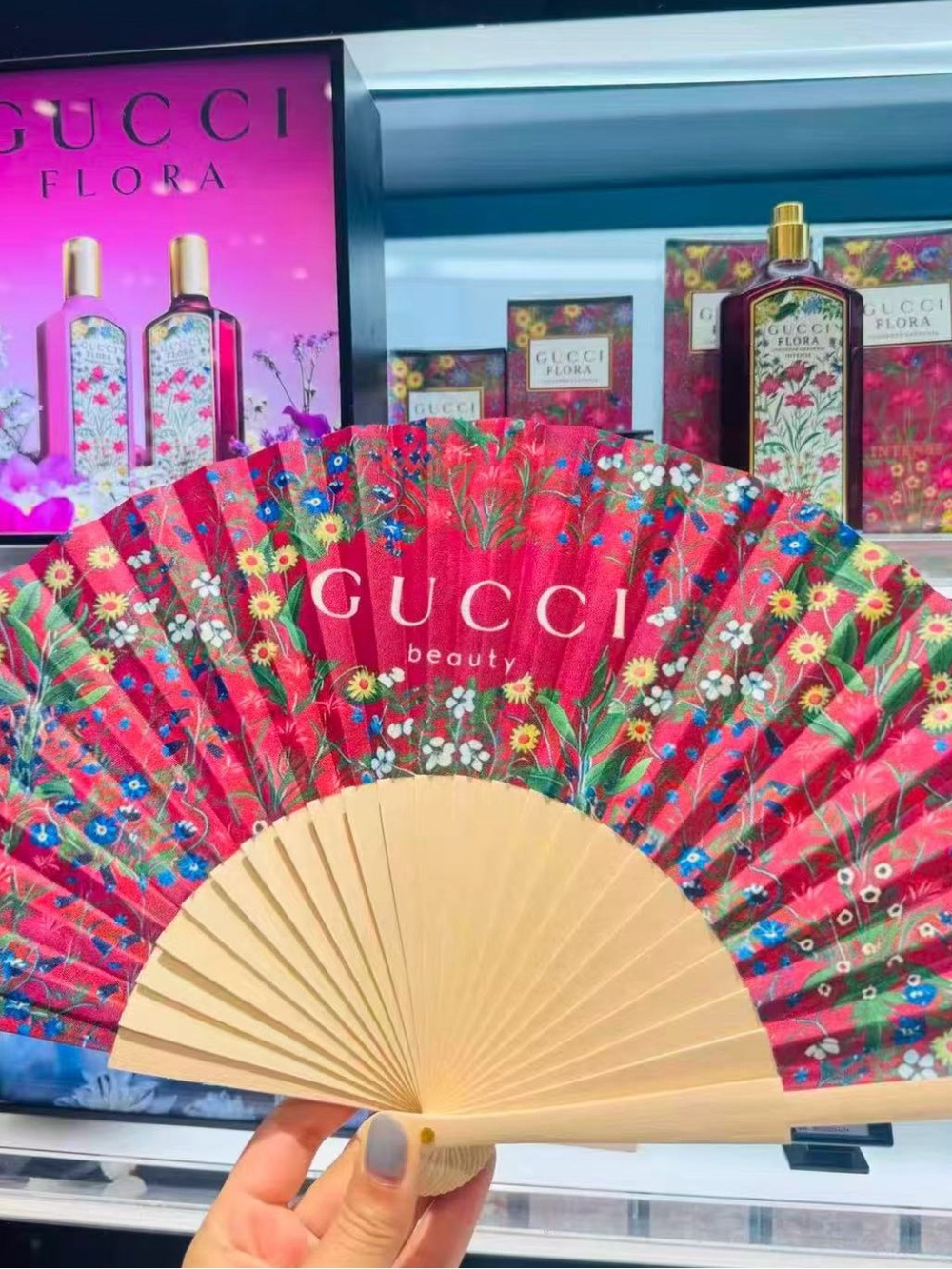 Gucci beauty gift holding fan